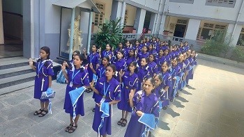 Guides Investiture — teacher enrolling a Guide